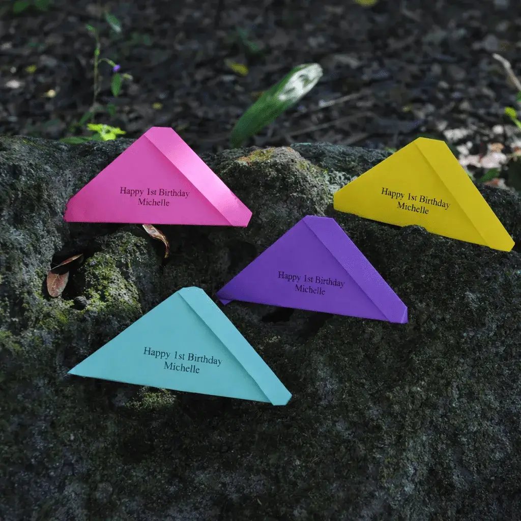 Four colorful personalized birthday butterfly release envelopes